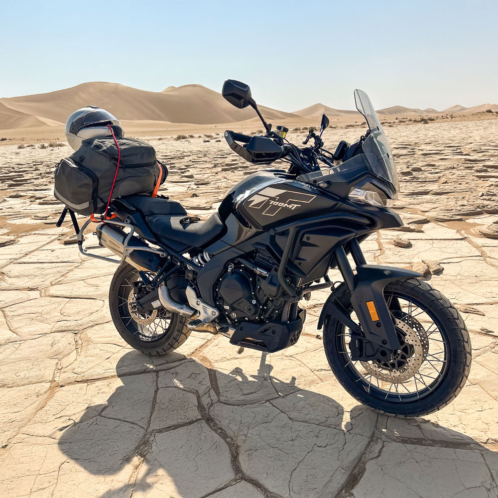 CFMoto 700MT adventure motorcycle standing in the Namib Desert in Namibia from RMC Motorcycle rental